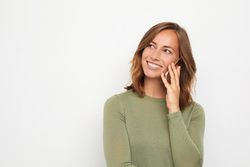 young smiling woman talking on the phone