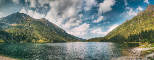 Tatra National Park, Poland. Famous Mountains Lake Morskie Oko Or Sea Eye Lake In Summer Morning. Beautiful Sunrise Sunrays Above Tatras Lake Landscape © Great Brut Here
