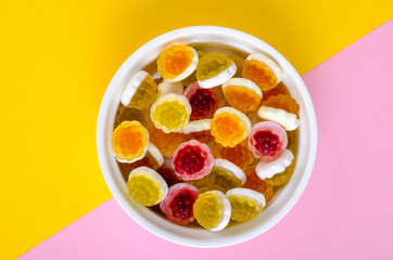 Sweet colored jelly candies on white plate