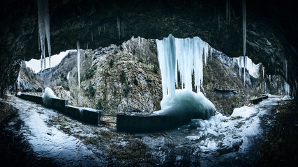 frosty canyon road in winter season - moody style image