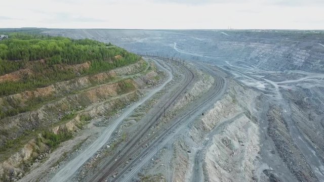 Open quarry for stone extraction. Quarry. Panorama aerial view. The problem of environmental pollution. Top view of the quarry