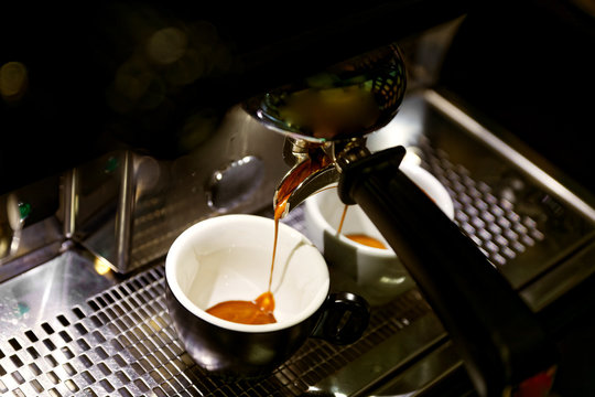 Coffee Brewing In Coffee Machine. Espresso Pouring In Two Cups.