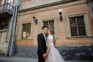 Affectionate young couple hugging looking at each other