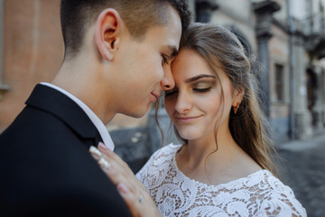 Affectionate young couple hugging looking at each other