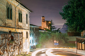 Fototapeta na wymiar Terracina, Italy. Castle Castello Frangipane In Background In Evening Night Illuminations