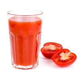 Glass with fresh tomato juice on white background