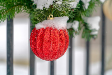 Garland with red glittered christmas ball ornament