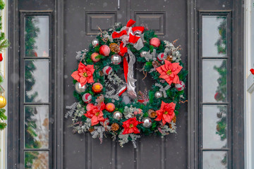 Glass paned front door with Christmas wreath © Jason