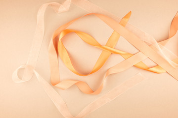 Multicolored ribbons on a beige background.