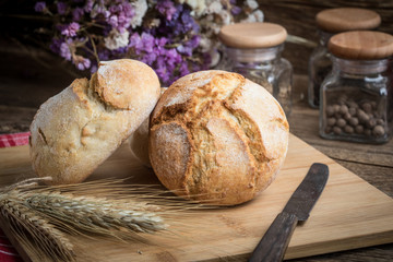 Roll breads on cutting board.