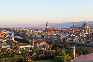 Fototapeta na wymiar Dawn in Florence, Italy. Cityscape skyline of Florence with Duomo, Basilica di Santa Maria del Fiore and the bridges. Firenze landmarks