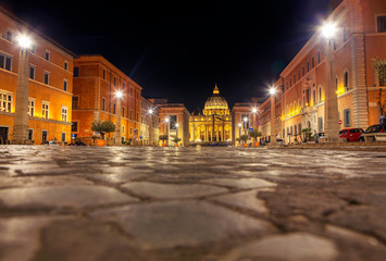 Fototapeta na wymiar night scene in Vatican view of pavement and San Pietro Cupola 