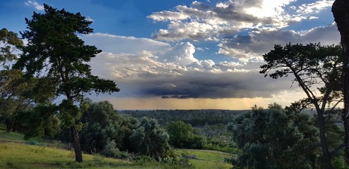 Storm clouds on the horizon with summer showers landscape