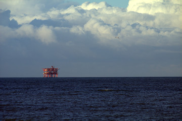 oil plant,horizon,hydrocarbon,extraction,industrial,sea,clouds,water