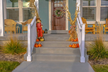Halloween decoration on stairs and wreath on door