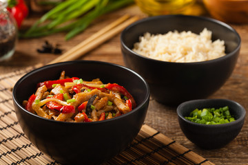 Pork chop with peppers, mushrooms and bamboo. Served with rice.