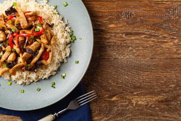 Pork chop with peppers, mushrooms and bamboo. Served with rice.