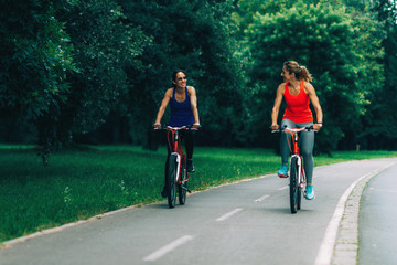 Women Riding Bicycles Together