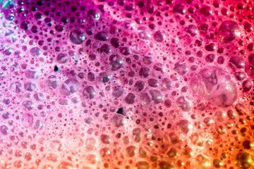 Macro shot of bright and vibrant bubbles in an ice cream cocktail glass