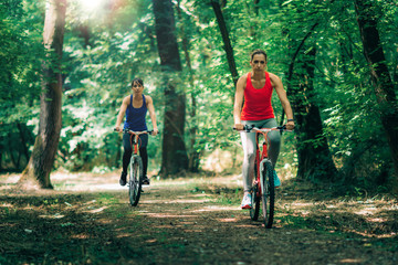 Naklejka premium Two Women Cycling Together