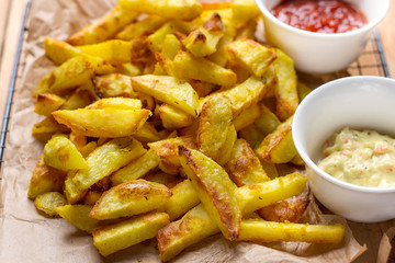 Healthy oven baked French fries with turmeric and curry spices