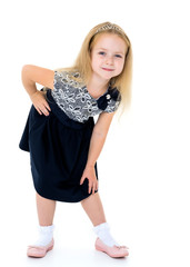 Little girl posing in studio on a white background.