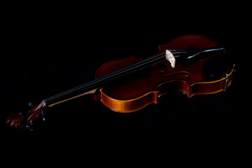 Violin music instrument of orchestra closeup isolated on black.Violin isolated on black. Classical...
