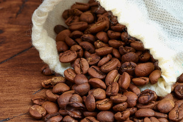 coffee beans on a wooden background scattered