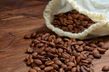 coffee beans on a wooden background scattered