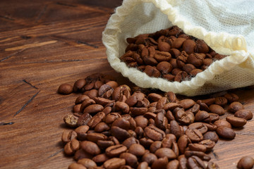 coffee beans on a wooden background scattered