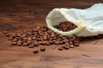 coffee beans on a wooden background scattered