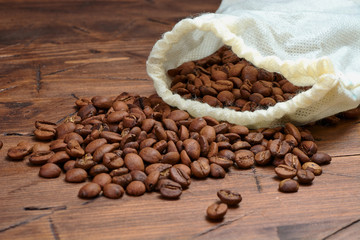 coffee beans on a wooden background scattered