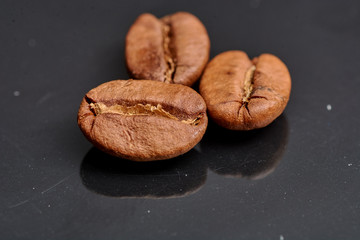 coffee beans on black background consistent with