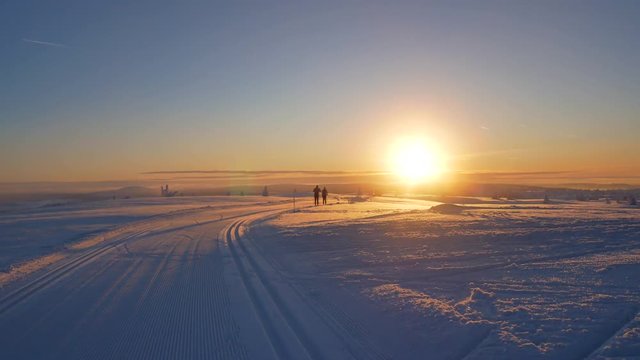 Cross country skiing during sunrise in Lillehammer Norway.
