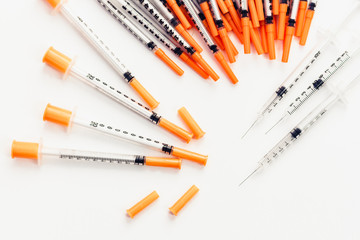 Pile of medical syringes for insulin for diabetes .