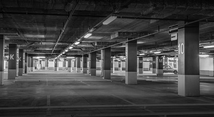 Empty car parking, new interiors spaces. Black and white photo