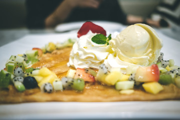 Fruit Salad Crepe with Mango & Passion Fruit Sauce and Vanilla Ice Cream