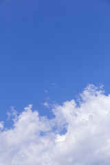 Blue sky background with white clouds, rain clouds on sunny summer or spring day.