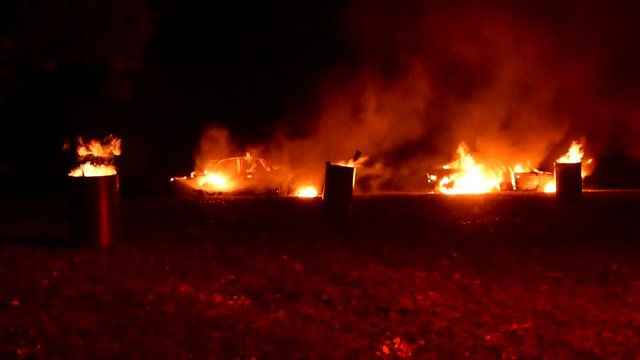 Burning cars in the street
