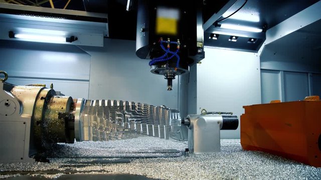 Cnc milling machine. Processing and cutting of parts from a piece of metal in the industrial area. Industrial exhibition of machine tools.