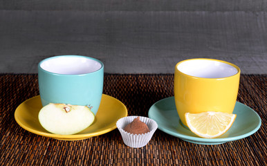 color saucers with cups on a wooden background.color saucers with cups on a white background