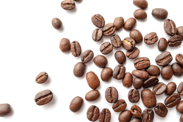 Roasted coffee beans isolated on white background. Close-up.