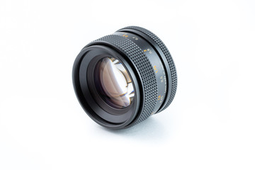 Close up of vintage camera lens on a white background