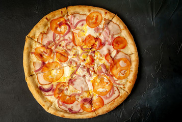 Delicious pizza on a concrete background. Top view of hot pizza.