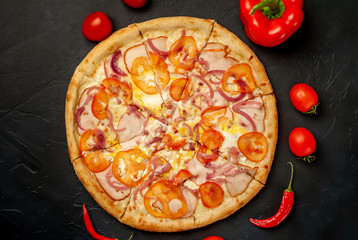 Delicious pizza on a concrete background. Top view of hot pizza.