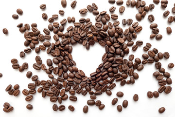 Heart frame of roasted coffee beans with area for copy space.