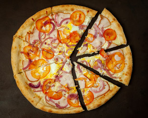 Delicious   pizza on a concrete background. Top view of hot pizza. 