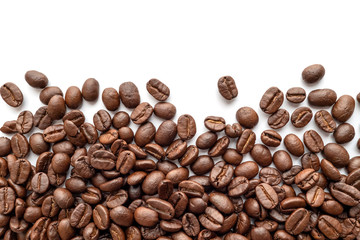 Roasted coffee beans on white background. Close-up.