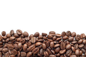 Roasted coffee beans on white background. Close-up.