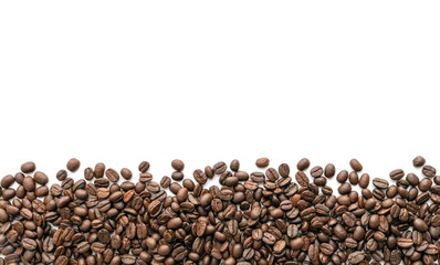 Roasted coffee beans on white background. Close-up.